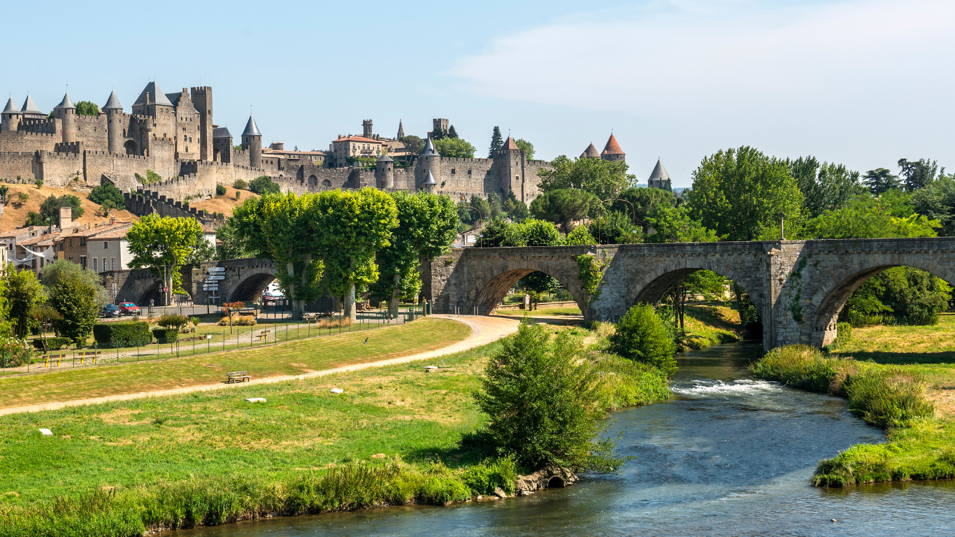 view overlooking the river that leads up to Carcassonne which looks like a huge ancient castle