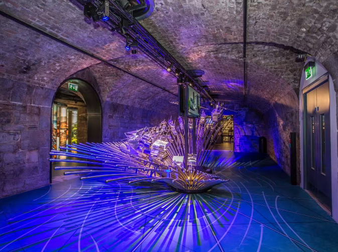 art piece lit up with blue lights inside the EPIC The Irish Emigration Museum