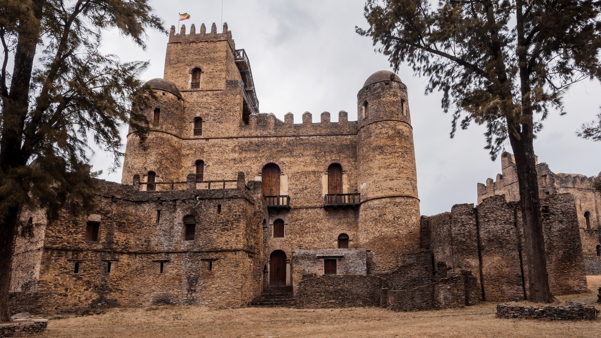 Fasil Ghebbi in Gondar, Ethiopia, featuring stone walls and towers with a blend of Ethiopian and medieval architecture.