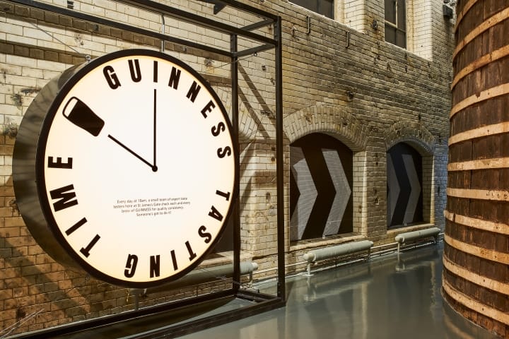 beer clock at Guinness Storehouse with brick walls and barrels for making beer