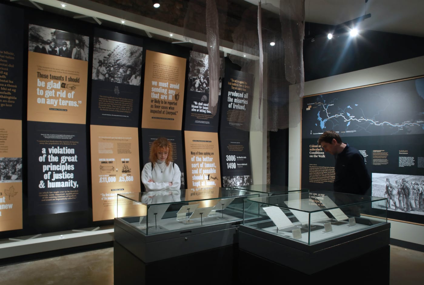 museums pieces being looked at by two persons at the Irish National Famine Museum