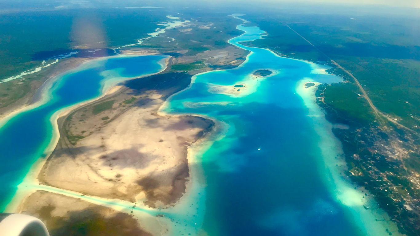  serene lagoon located with incredibly clear waters and sandy beaches at Laguna Bacalar in Mexico