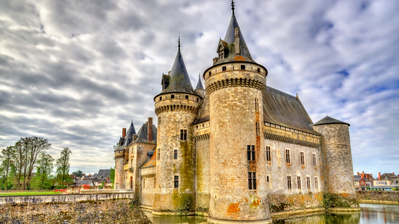 looking up close at the beautiful castle at Loire Valley , surrounded by water in the early fall