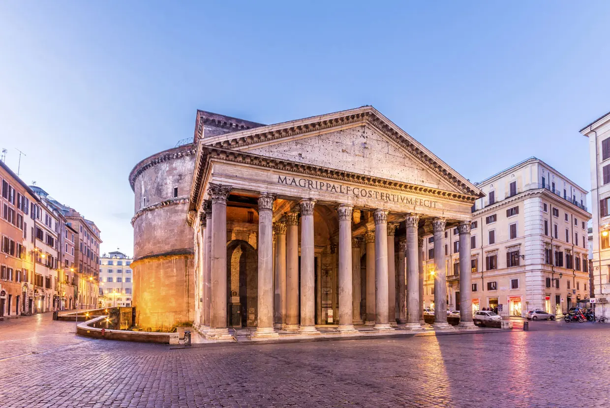 front of the Pantheon building in Rome surrounded by cobble stone streets