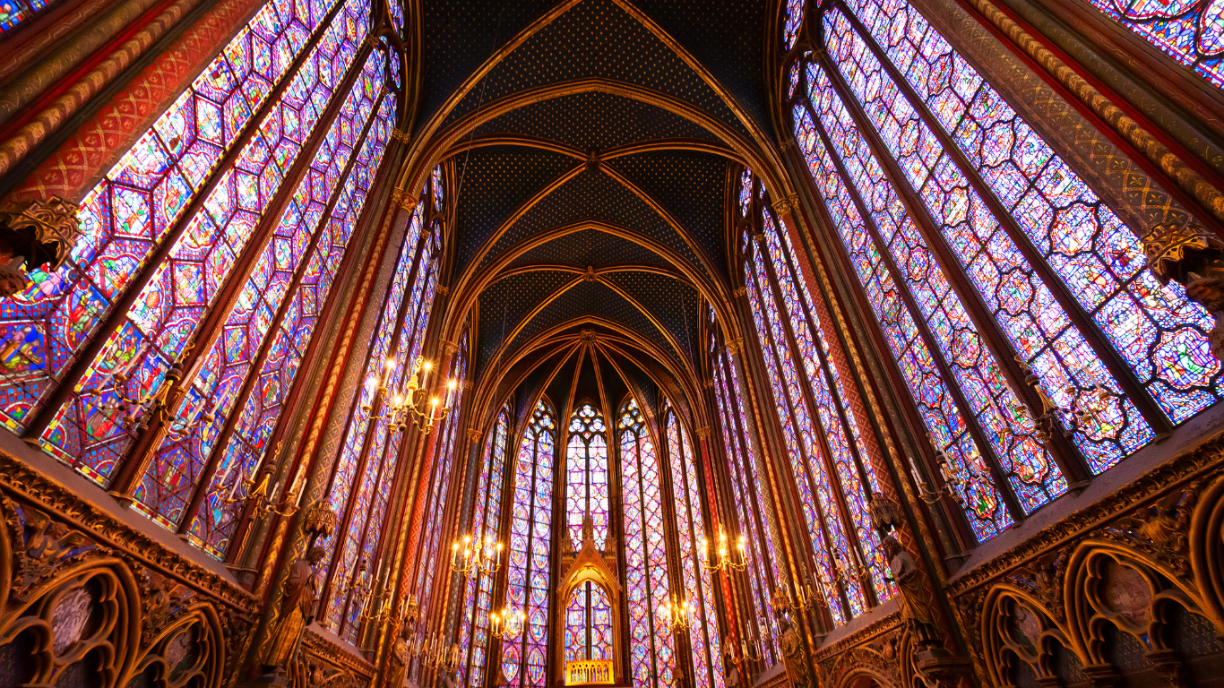 inside of the Sainte-Chapelle church colorful stained glass in Paris