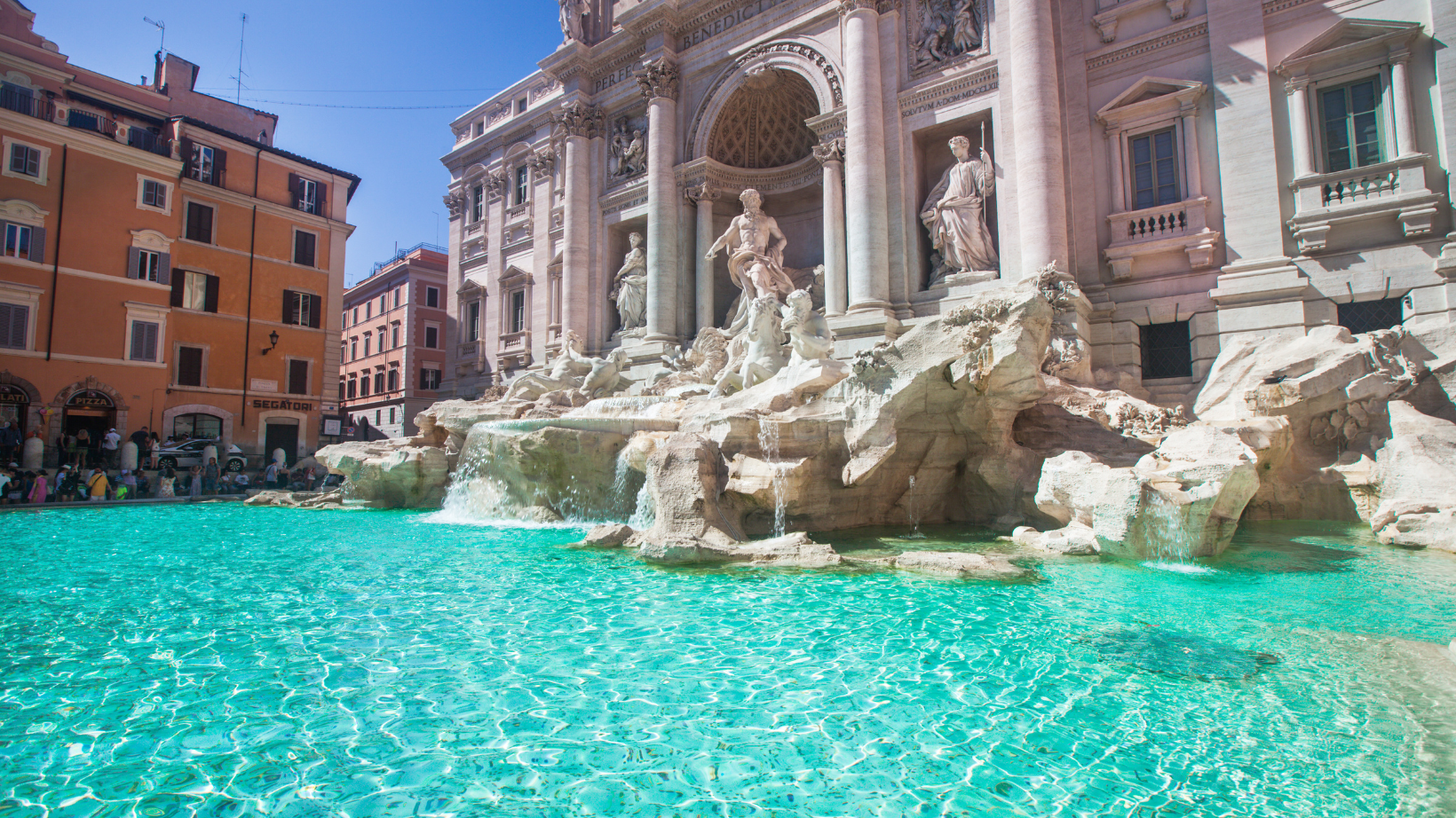 crystal clear blue water at the Trevi Fountain