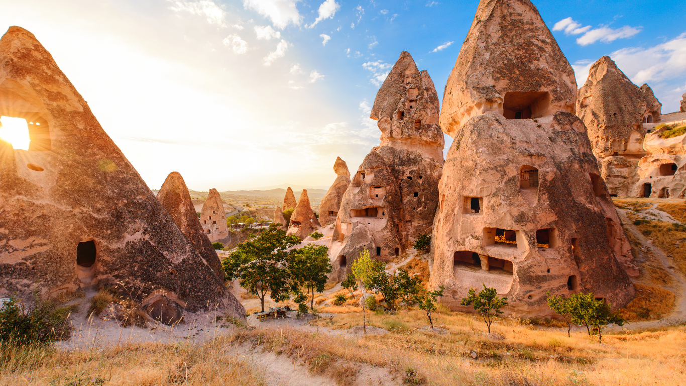 Sunny day in the ancient city of Harran Turkey where the remains of Beehive looking homes are on display.