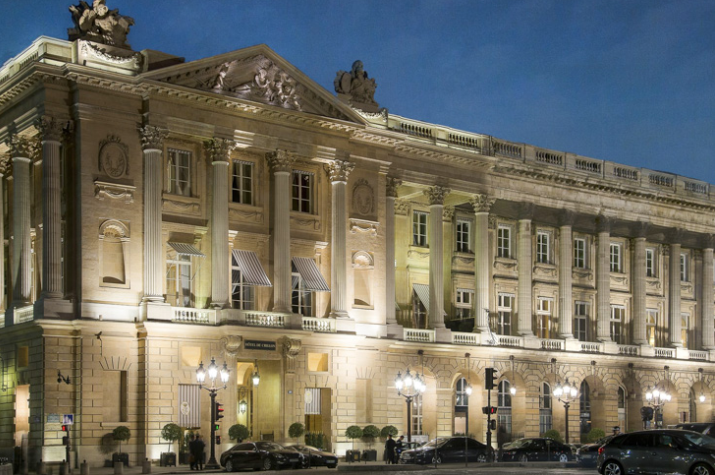 nighttime looking at the front of the Parisian style Hôtel de Crillon, A Rosewood Hotel