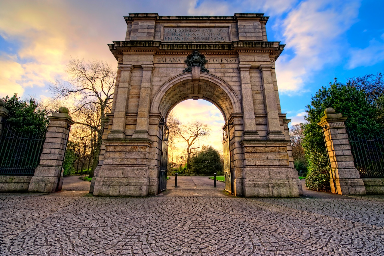 arch walkway with brick cobblestone path that goes under it at Visit St. Stephen's Green