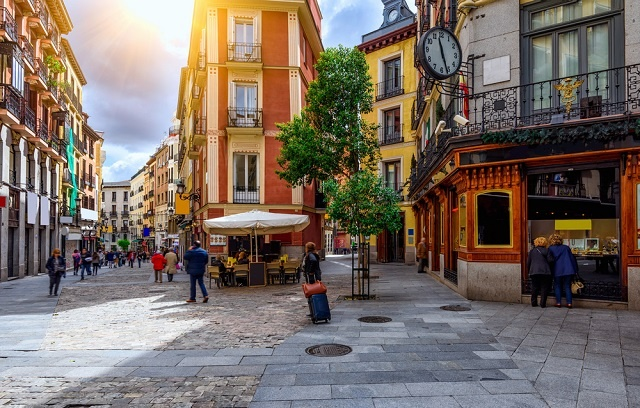 stone streets with people out enjoying the day in the Salamanca District in Madrid