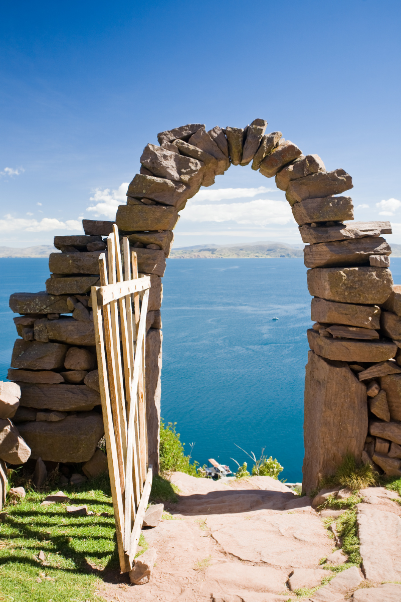 A pretty rock arch on Taquile Island on - Lake Titicaca Travel Guide