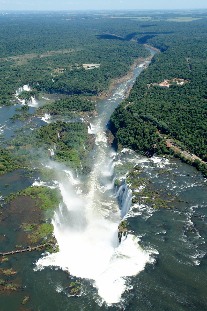 Ariel View Of Devils Throat Waterfall which is a missive waterfall that appears to being falling off a massive drop and turning back into a river.