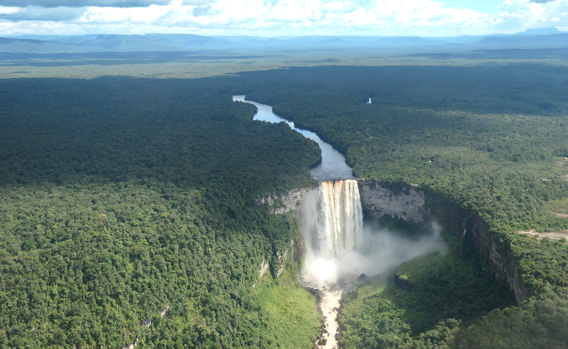 Kaieteur Falls from above which is a giant waterfall and showing the river that leads into the falls. 