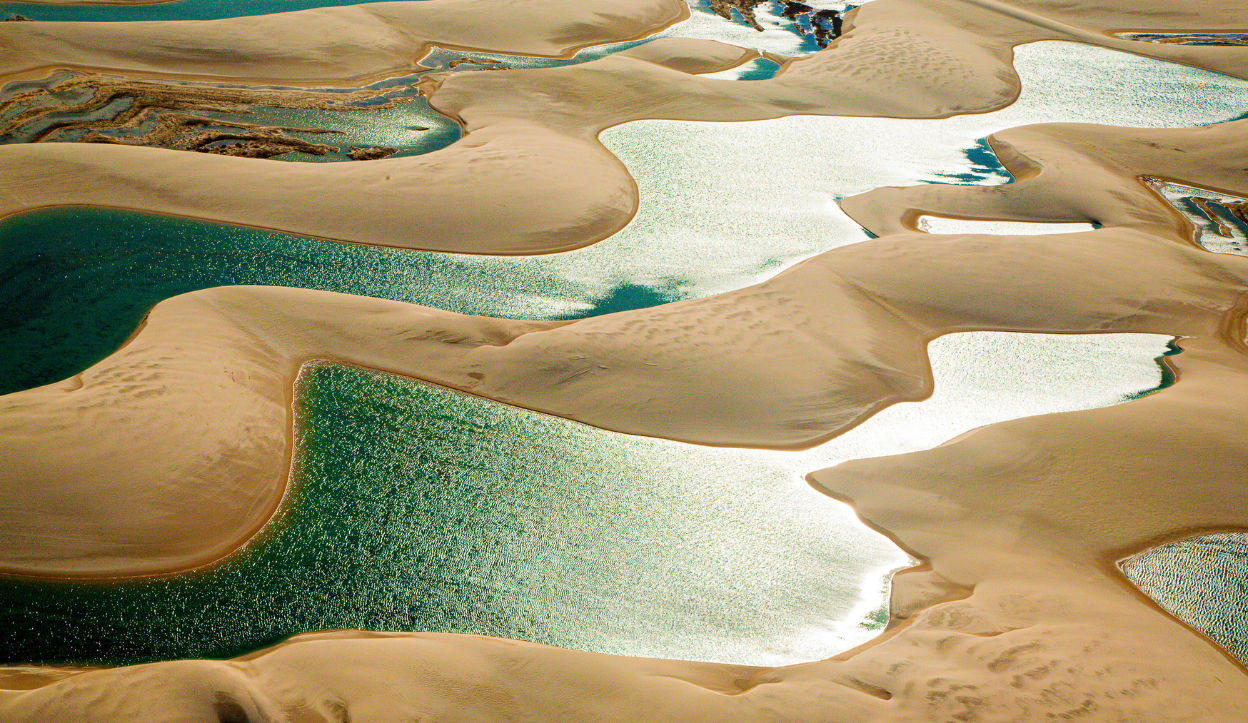 Lençóis Maranhenses National Park water separated by sand patches in the desert