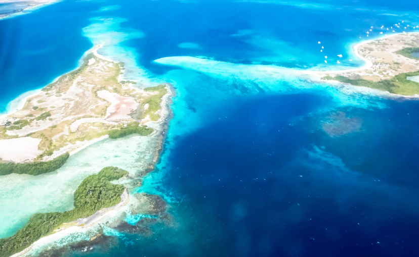 Ariel view of cystal clear waters and sandy islands at the Los Roques Archipelago, which is a cay of islands