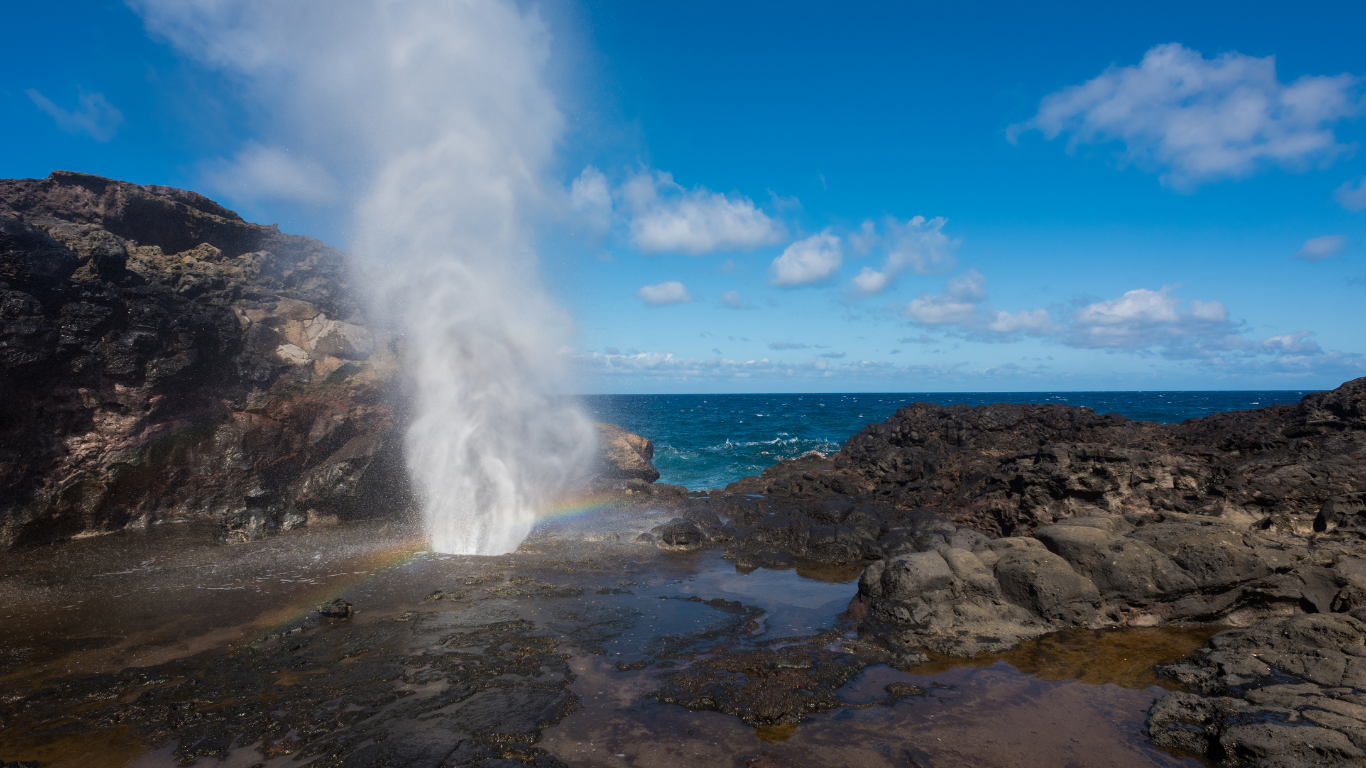 Nakalele Blowhole shooting up through the rocks with the the ocean in the background