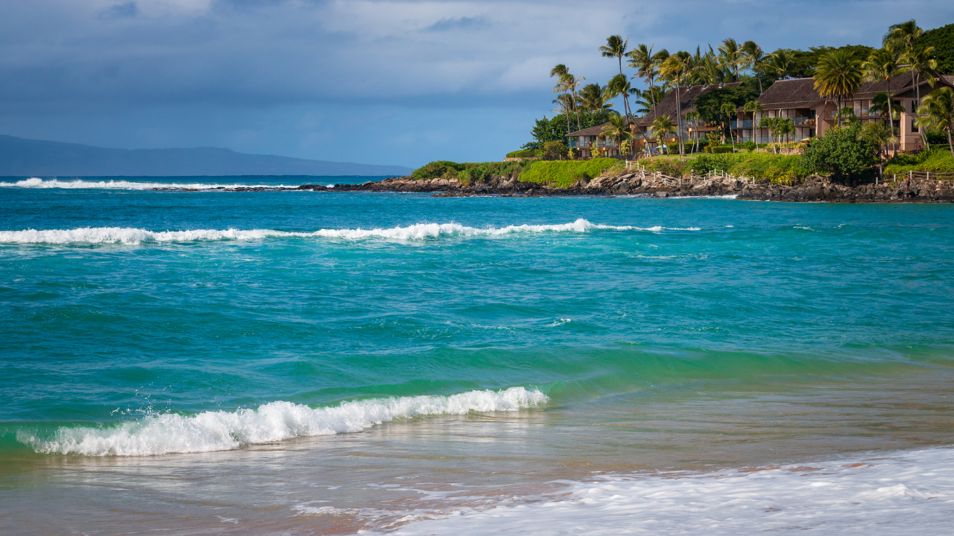 waves rolling in and crashing ashore at Napili Bay in Maui, Hawaii