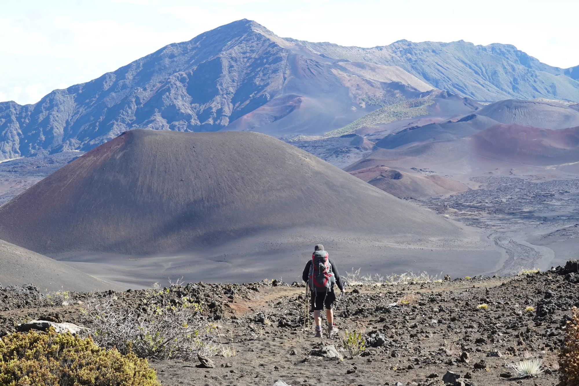 Man walking in the valley of the Keonehe'ehe'e Trail in Haleakala National Park