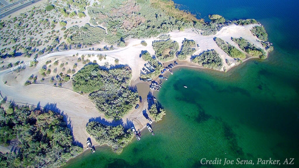 Ariel view of body beach in lake havasu with clear waters and white sandy beach.