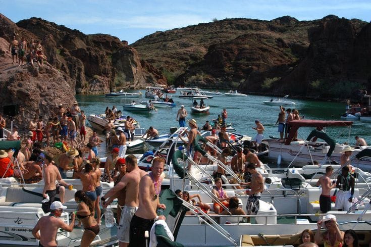 boats tied up in Copper Canyon on Lake Havasu with people partying and having a good time. 