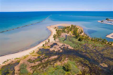 Ariel view of Walnut Beach Park in Ashtabula, Ohio with clear pretty waters and a roped off swim area with shallow waters for people to swim and enjoy lake Erie. 