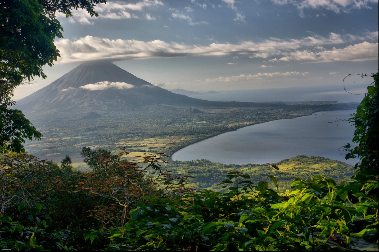 Ariel view of a volcano and lush valley leading to the beach in Nicaragua. 