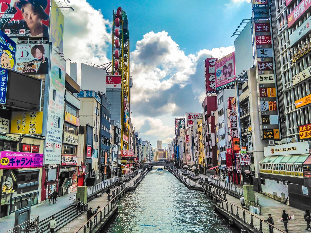 Canal running between two city blocks in Dotonbori, a popular district in Osaka Japan