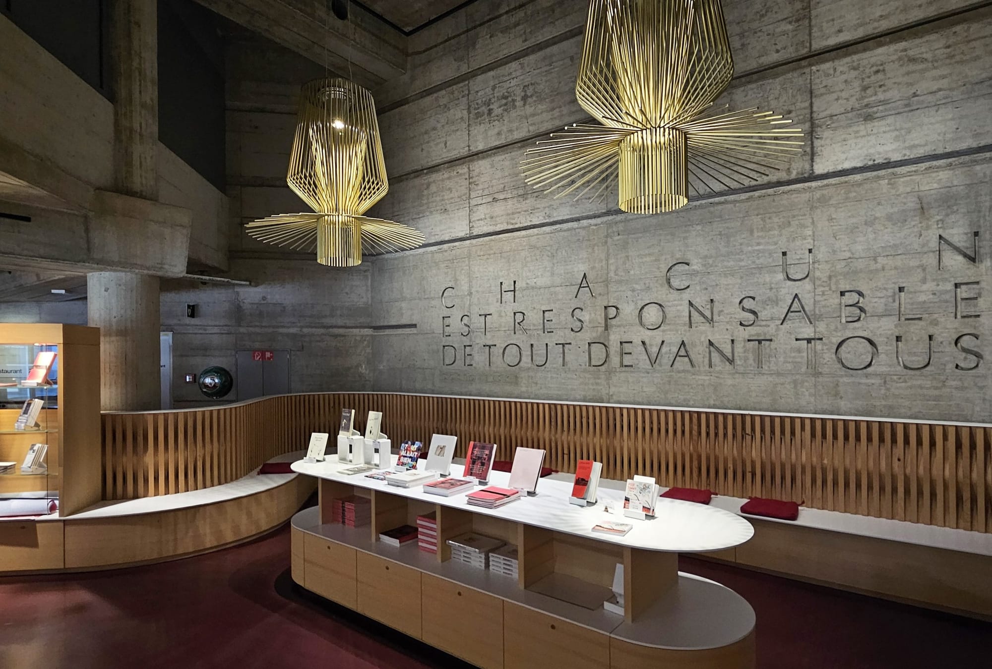  Interior of the International Red Cross and Red Crescent Museum in Geneva, Switzerland, featuring modern decor and a book display.