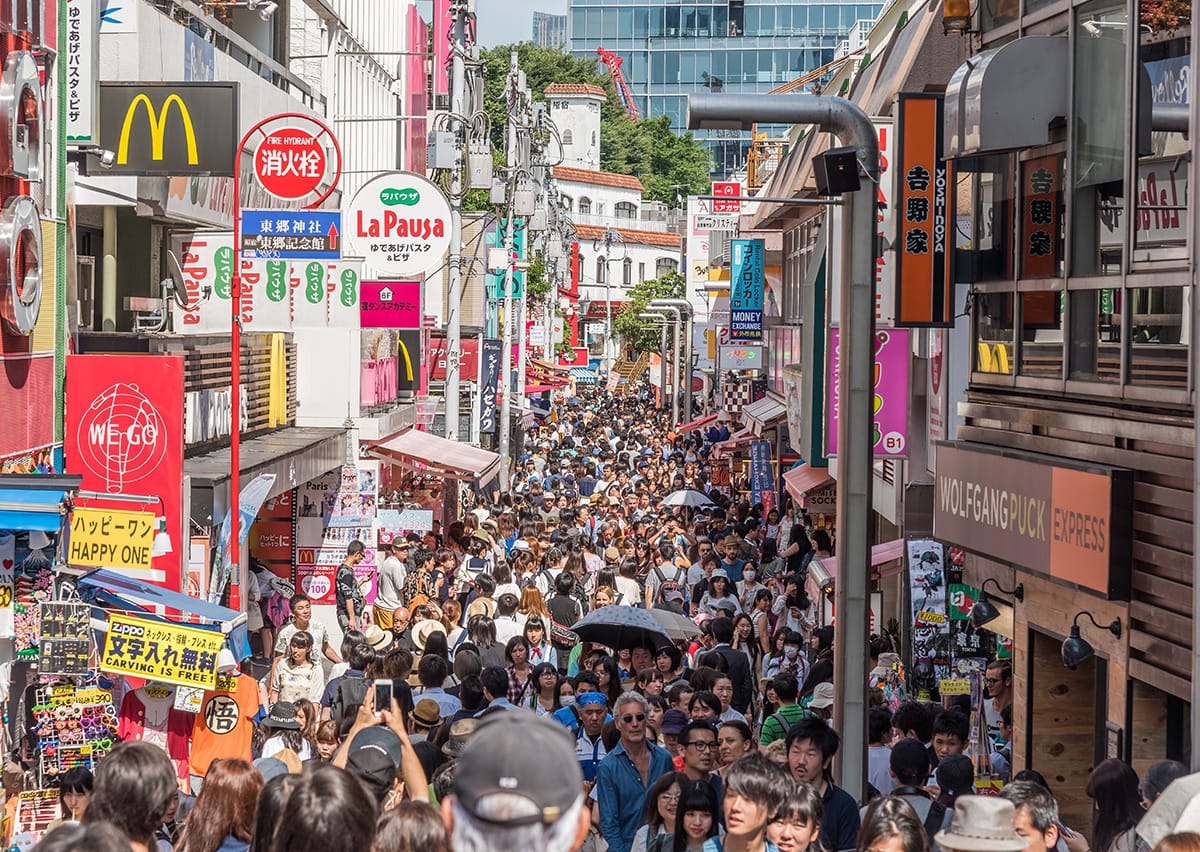 an insane amount of people walking on a packed street that is Takeshita Street in Harajuku