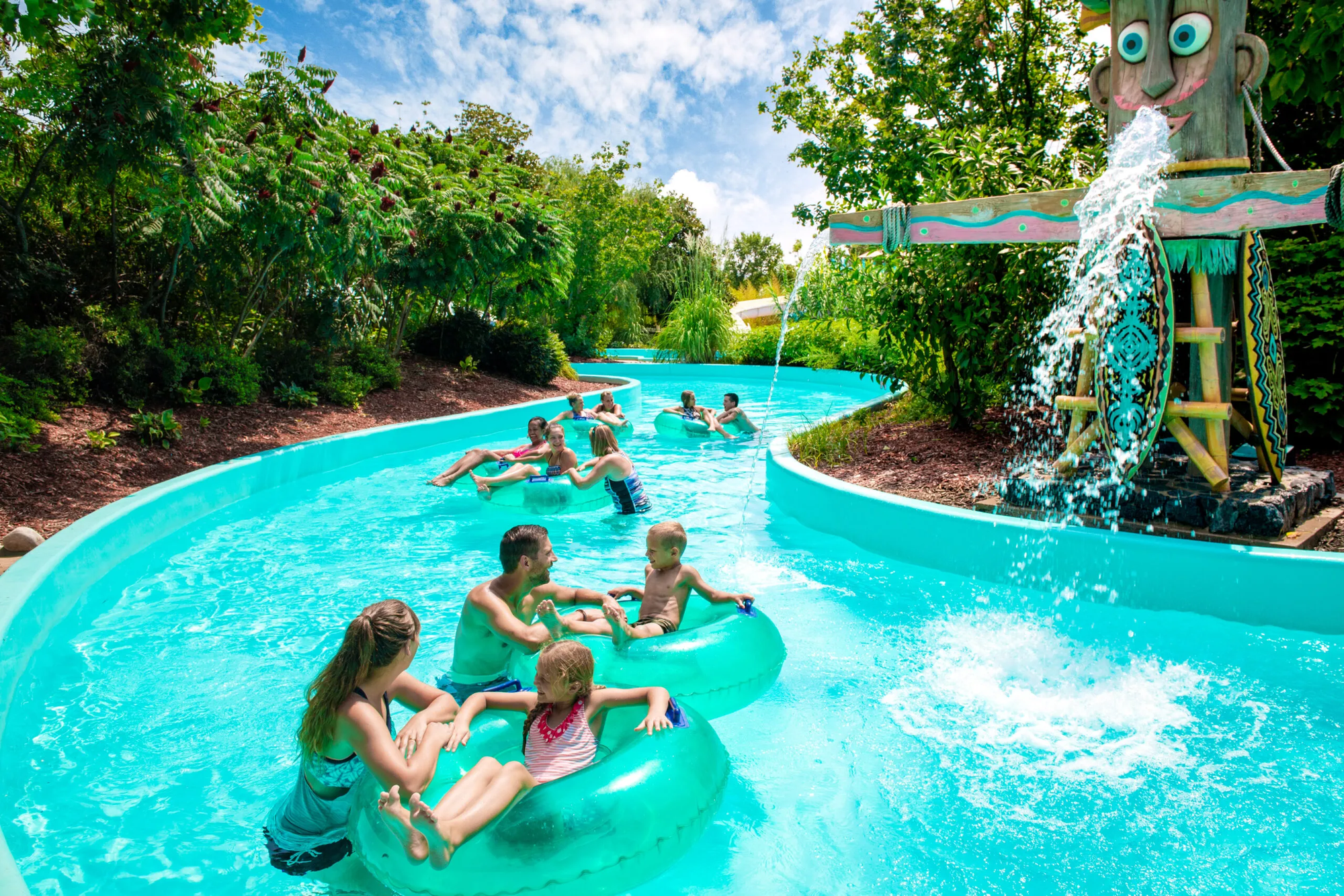 a family going down a waterslide in tubes having fun at Branson's White Water in Branson Missouri.