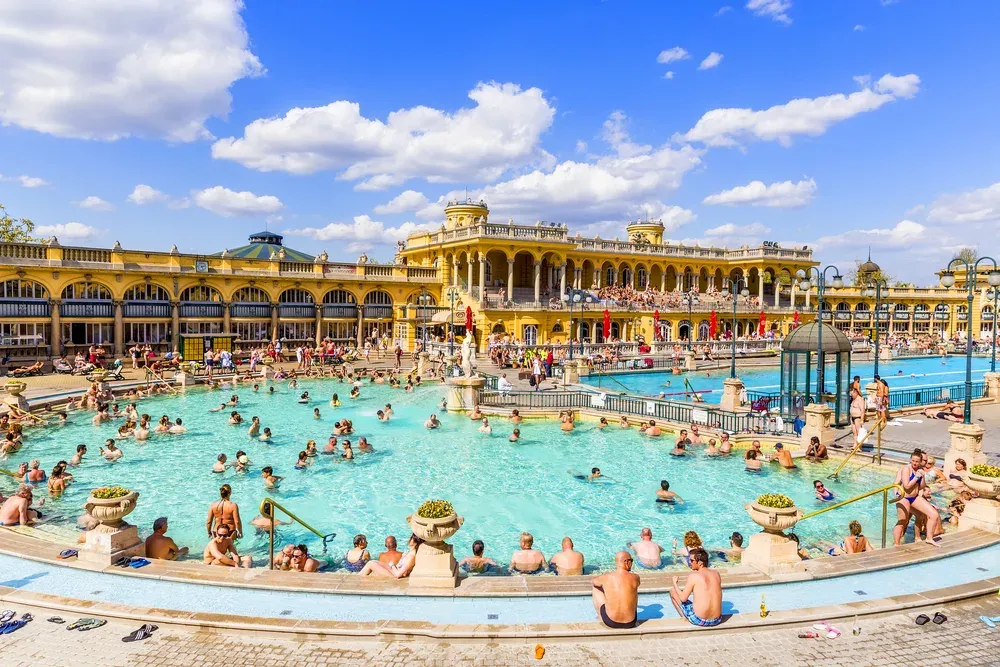 Lots of people at a thermal bath house in Budapest. 