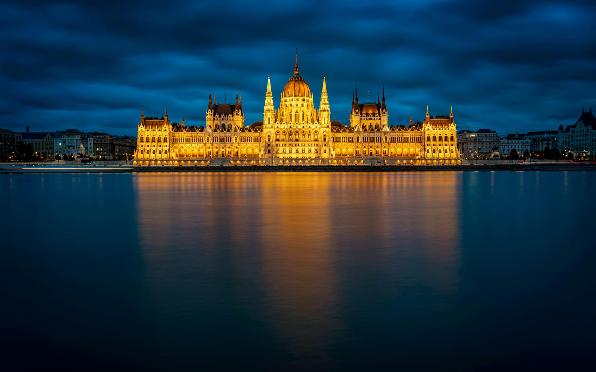 Nighttime view of the Budapest Parliament Building from across the river.