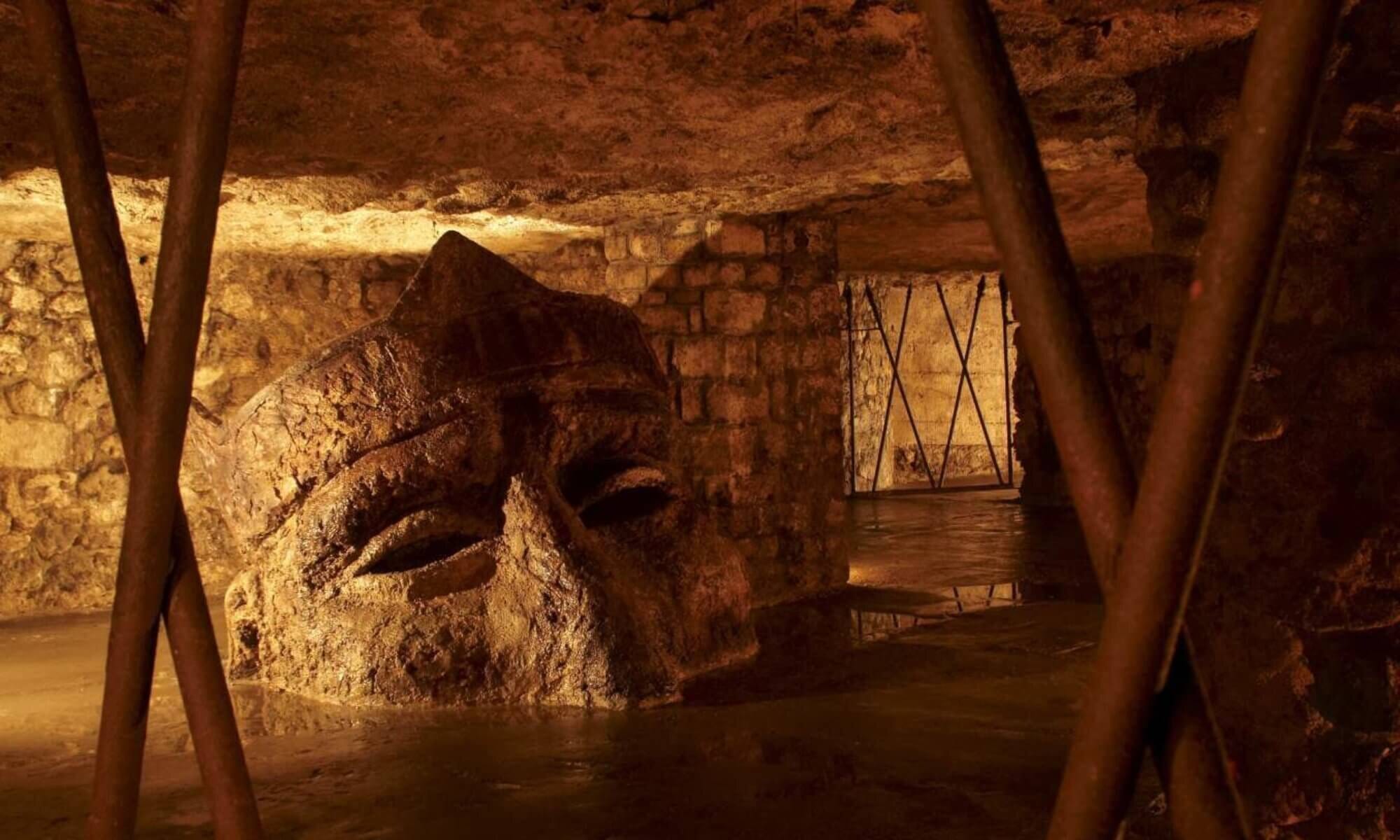 Underground tunnel of Buda Castle has a rock face of a person. 