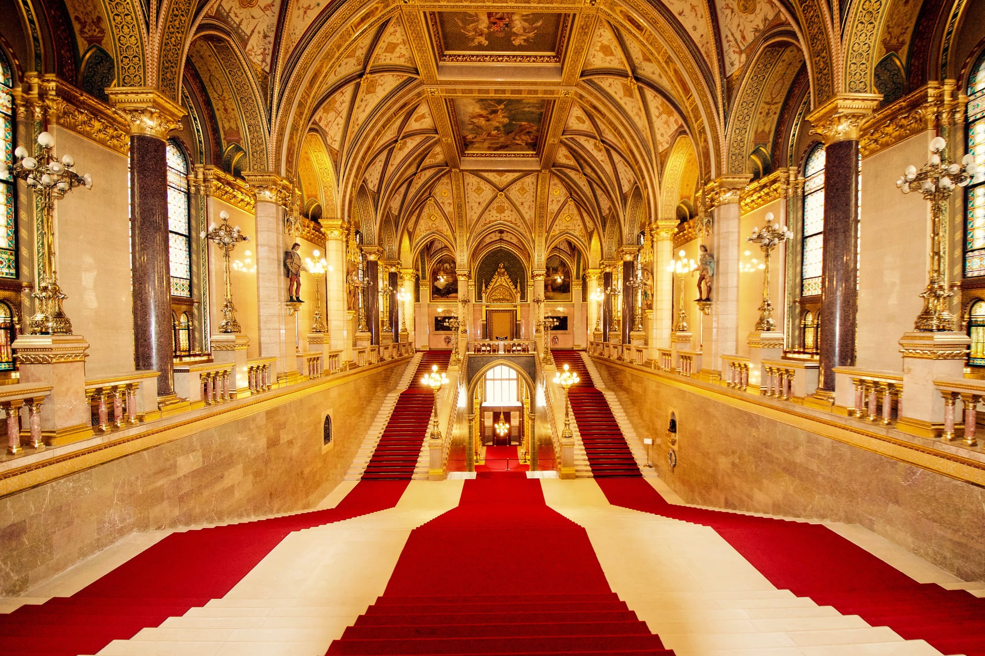 Red and white carpet on the stairs inside of the Budapest Parliament Building. 