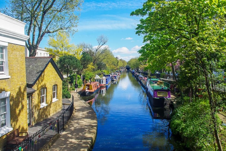  Little Venice in London, UK, featuring a scenic canal lined with colorful houseboats.